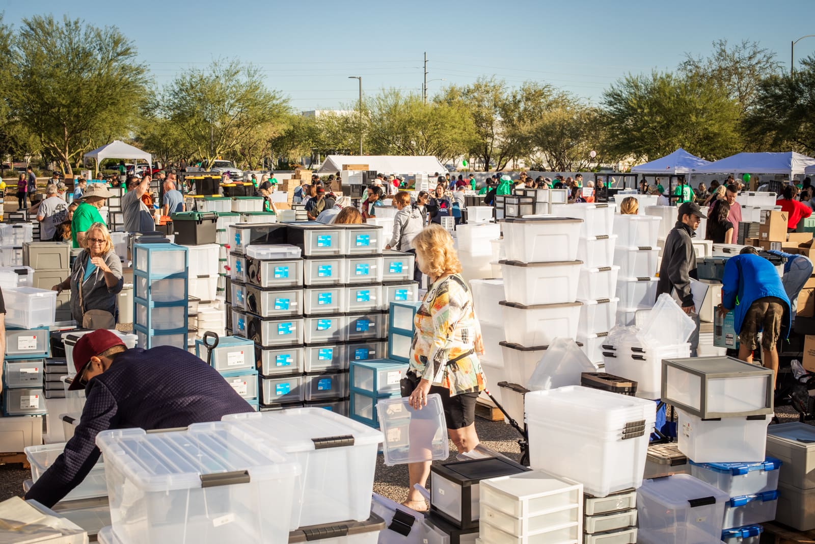 Shoppers browse storage bins and organizers at the IRIS USA warehouse sale in Surprise, Arizona.