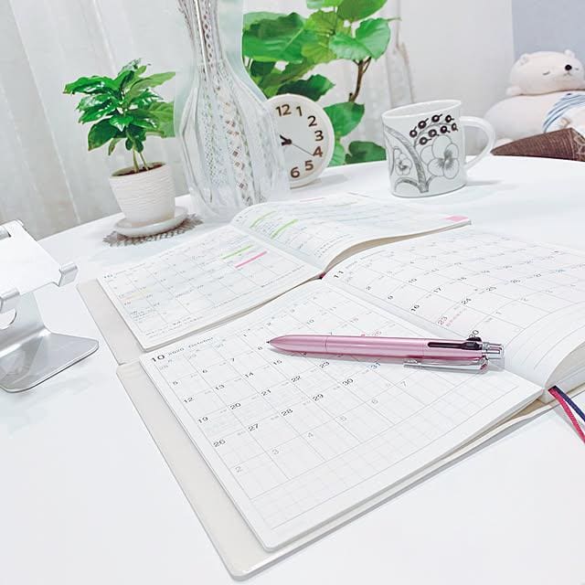 Notebook and calendar representing time for rest and reflection