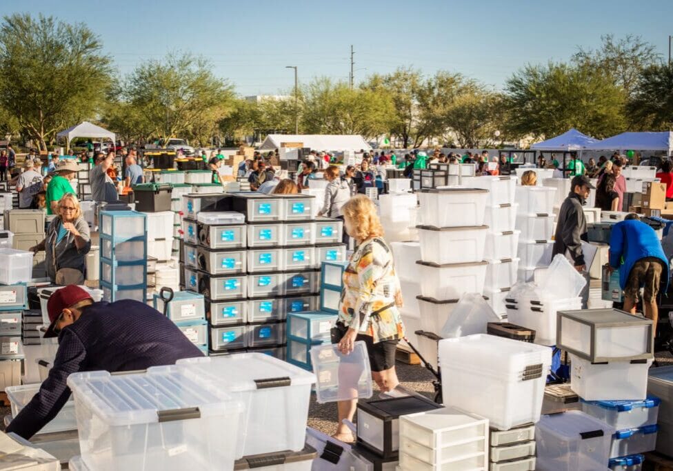 Shoppers browse storage bins and organizers at the IRIS USA warehouse sale in Surprise, Arizona.