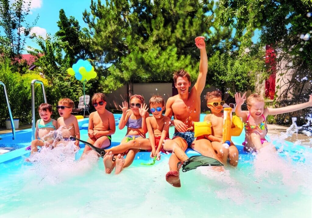 A group of people in the water at an amusement park.