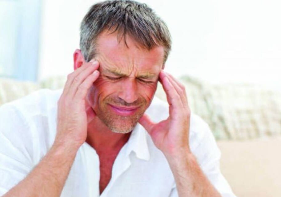 A man with his hands on his head.